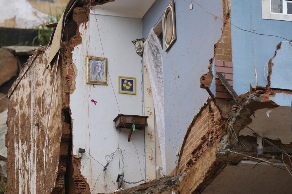A home's interior wall is exposed after it was destroyed by mudslides on the third day of rescue efforts in Petropolis, Brazil, Friday, Feb. 18, 2022. (AP Photo/Silvia Izquierdo)